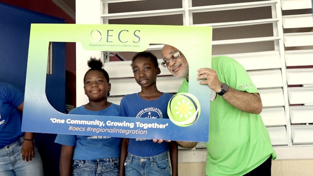 Dr. Didacus Jules, Director General of the Organisation of Eastern Caribbean States interacting with students of the Violet O. Jeffers-Nicholls Primary School at an OECS in the Classroom on June 14, 2023, as part of the activities marking the organisation’s 42nd anniversary in St. Kitts and Nevis